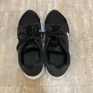 Kids Black and White Nike sneakers